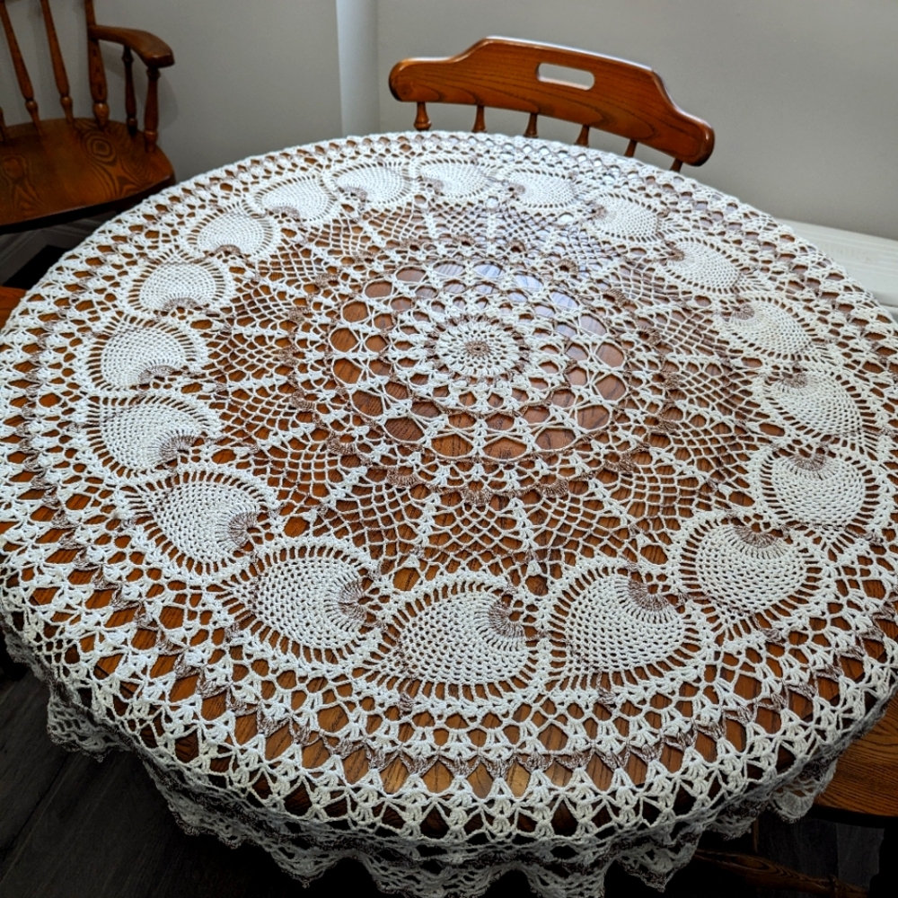 - - Hand made crocheted table cloth. approximately 4 feet in diameter…